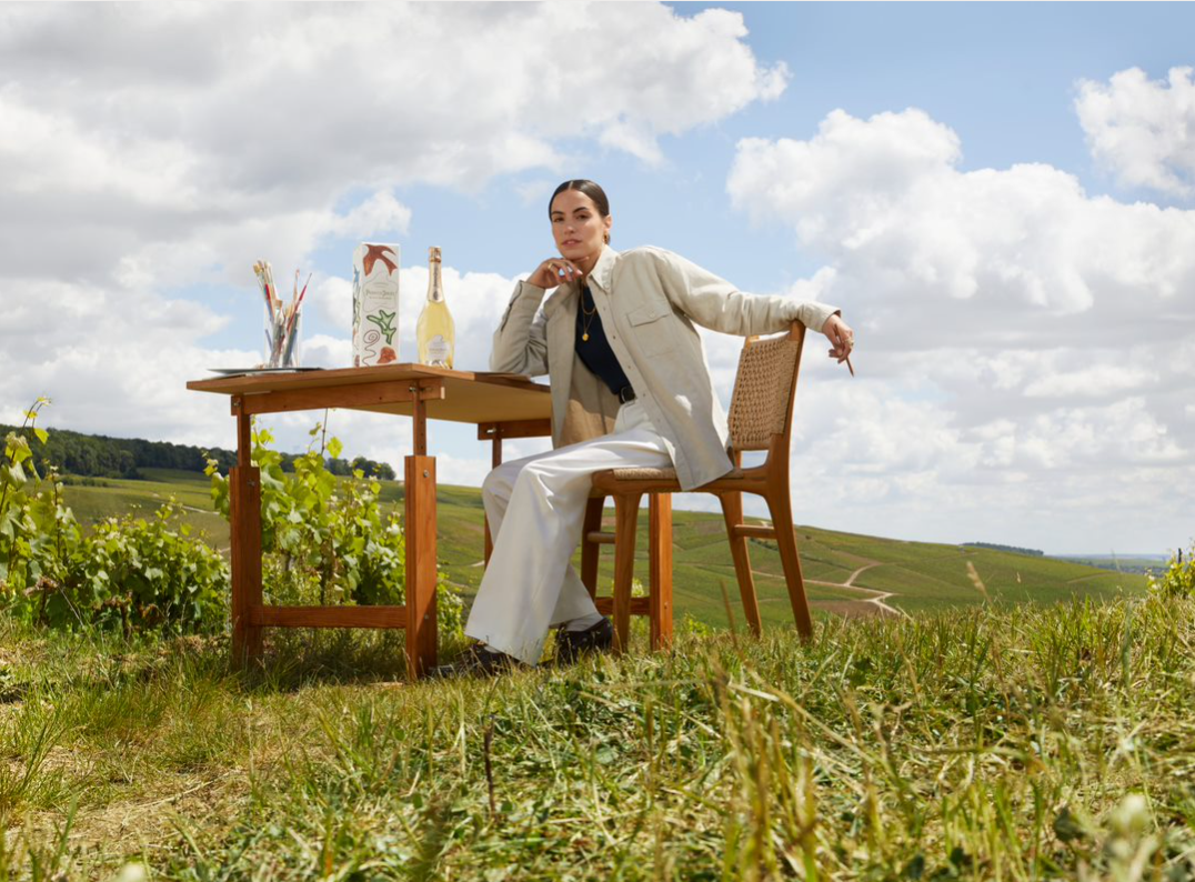 Garance Vallée outside with a bottle of Perrier-Jouët Blanc de Blancs