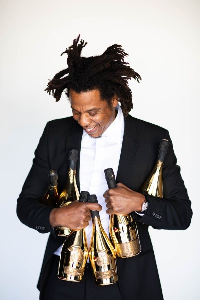Jay-Z with bottles of Armand de Brignac