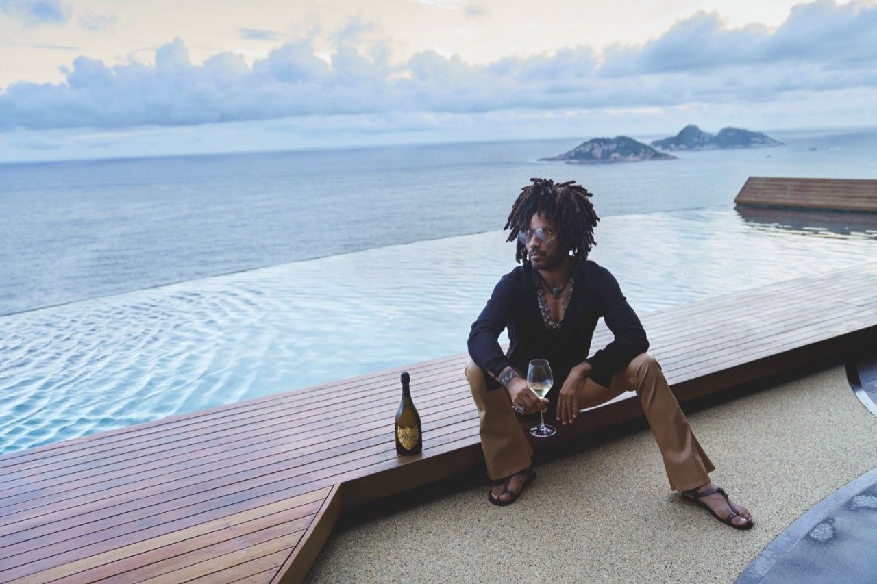 Lenny Kravitz drinking Champagne at the beach