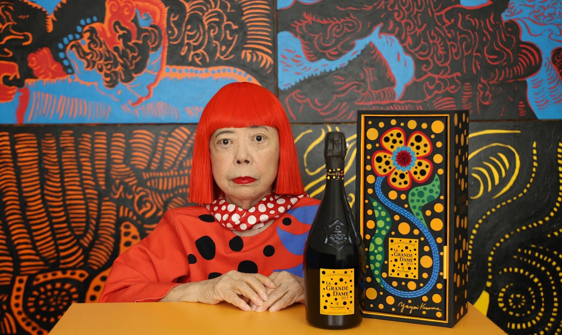 Yakoi Kusama with bottle of Veuve Clicquot La Grande Dame